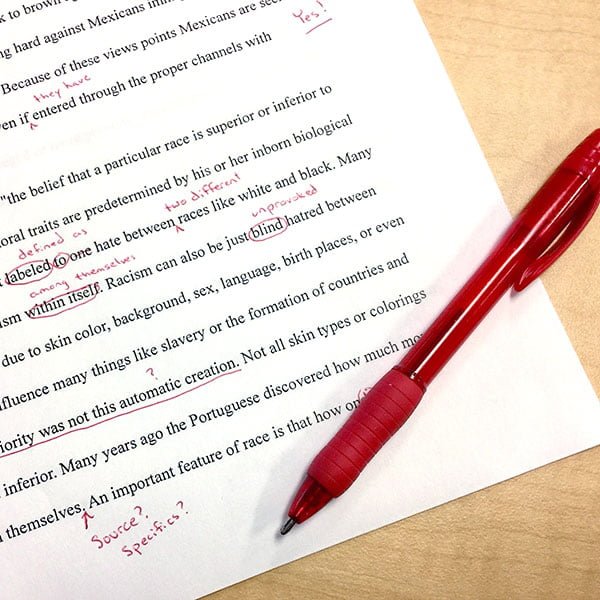 edited paper and red pen