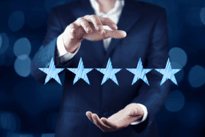 pair of hands with 5 stars in front